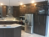 Kitchen with Dark Stain and Quartz Tops - right view