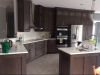 Kitchen with Dark Stain and Quartz Tops